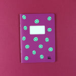 Notizheft brombeer mit mintfarbenen Smiles, kariert, DIN A5