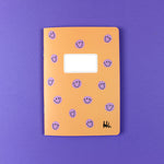 Notizheft apricot mit lila Smiles, liniert, DIN A5